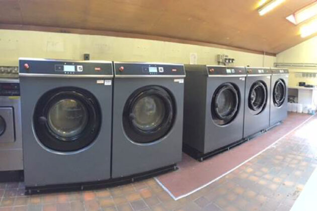 A row of Lavamac Commercial Washing Machines