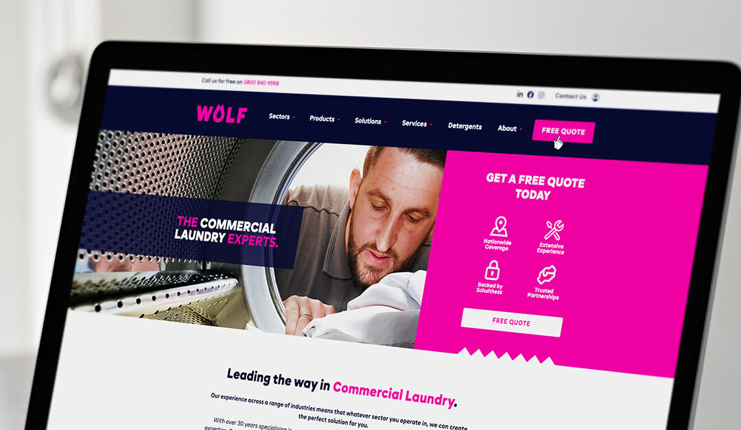 A laptop showing the Wolf website